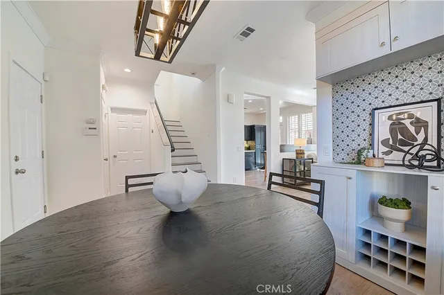 a kitchen with stainless steel appliances granite countertop wooden cabinets a stove top oven a sink and dishwasher