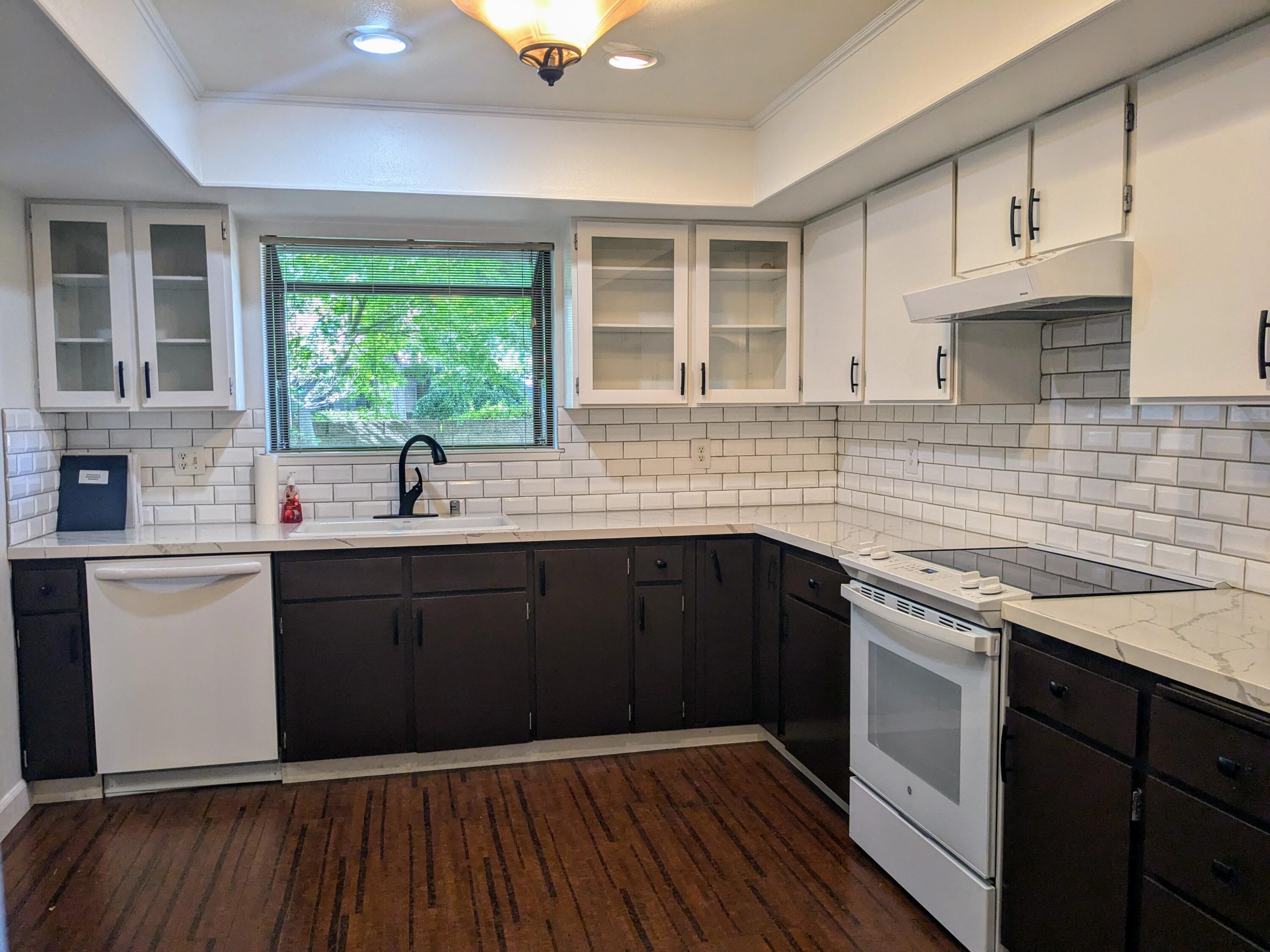 1974 Bechelli Lane Redding, CA 96002 - Photo 14 of 49 a kitchen with a sink stove and cabinets