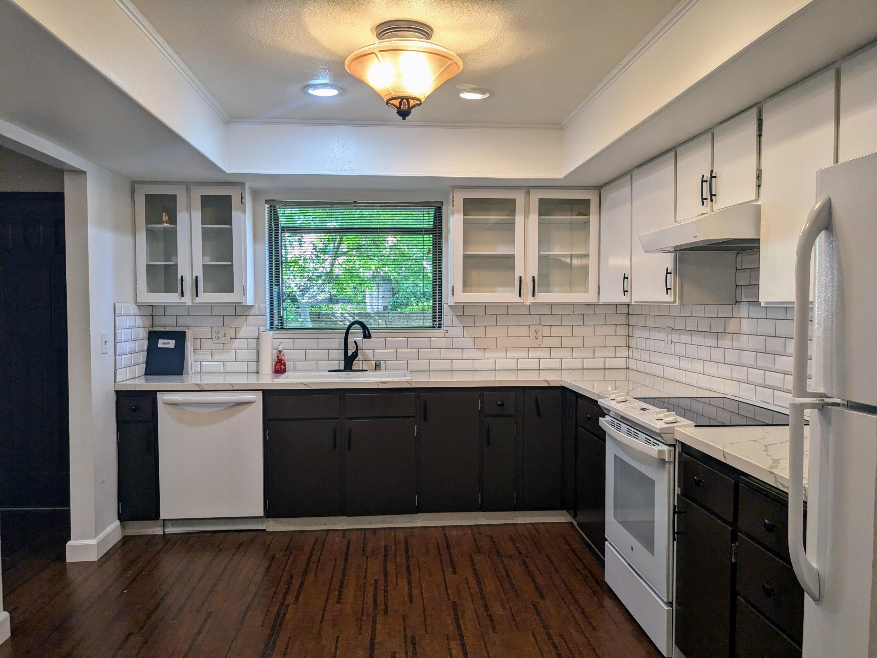 1974 Bechelli Lane Redding, CA 96002 - Photo 16 of 49 a kitchen with a sink stainless steel appliances and cabinets