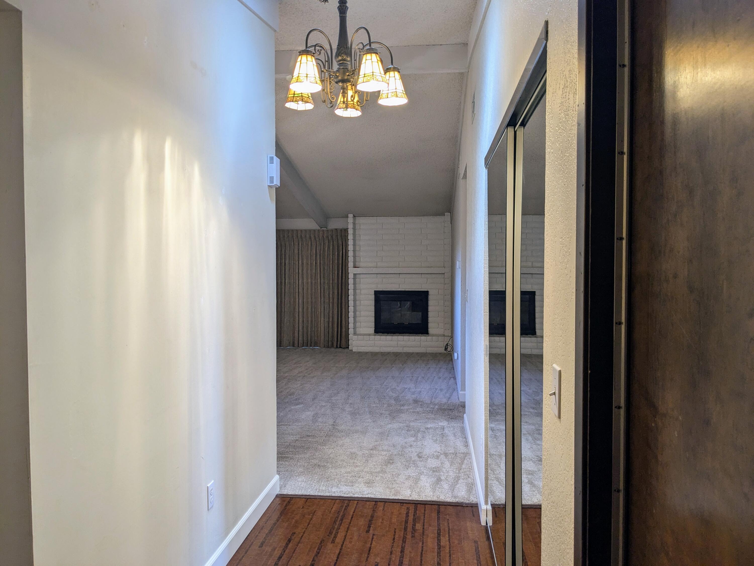 1974 Bechelli Lane Redding, CA 96002 - Photo 21 of 49 a view of a livingroom with wooden floor a ceiling fan and window