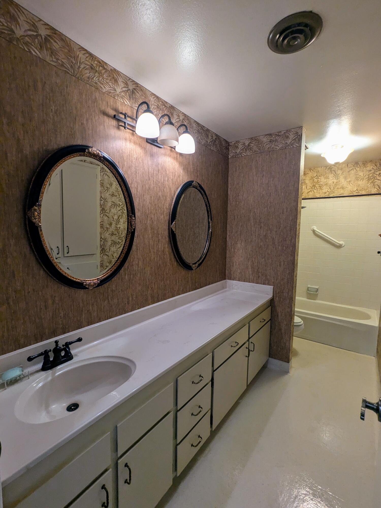 1974 Bechelli Lane Redding, CA 96002 - Photo 30 of 49 a bathroom with a sink and a mirror