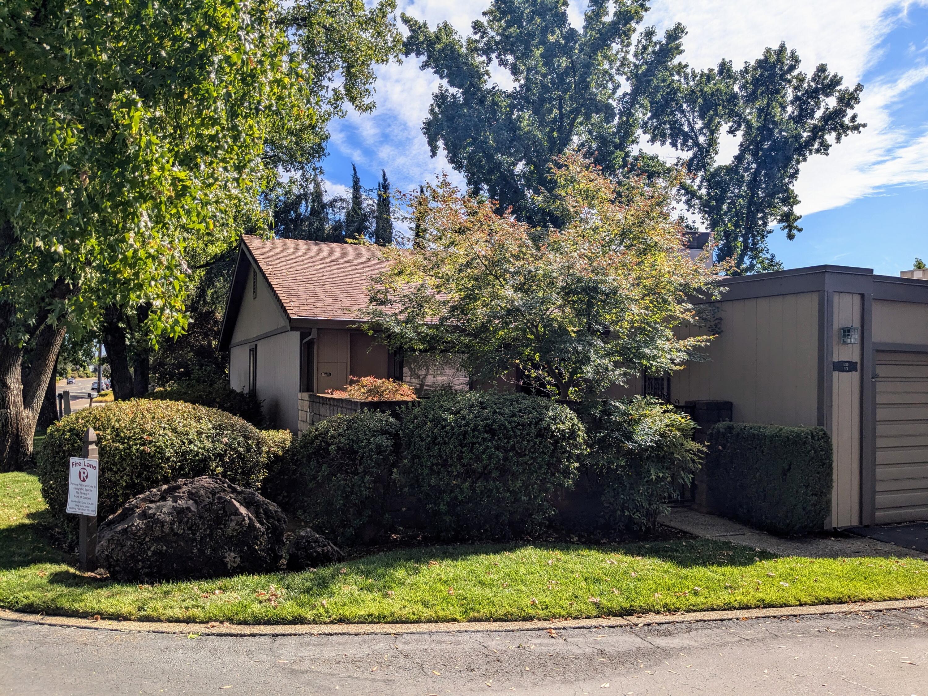 1974 Bechelli Lane Redding, CA 96002 - Photo 3 of 49 a view of a house with a yard and large tree