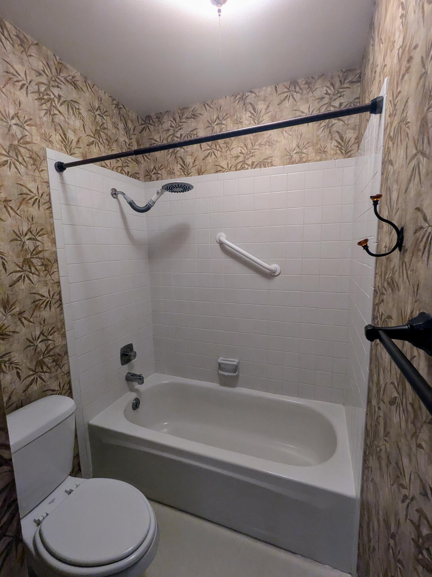 1974 Bechelli Lane Redding, CA 96002 - Photo 31 of 49 a bathroom with a toilet and a bathtub