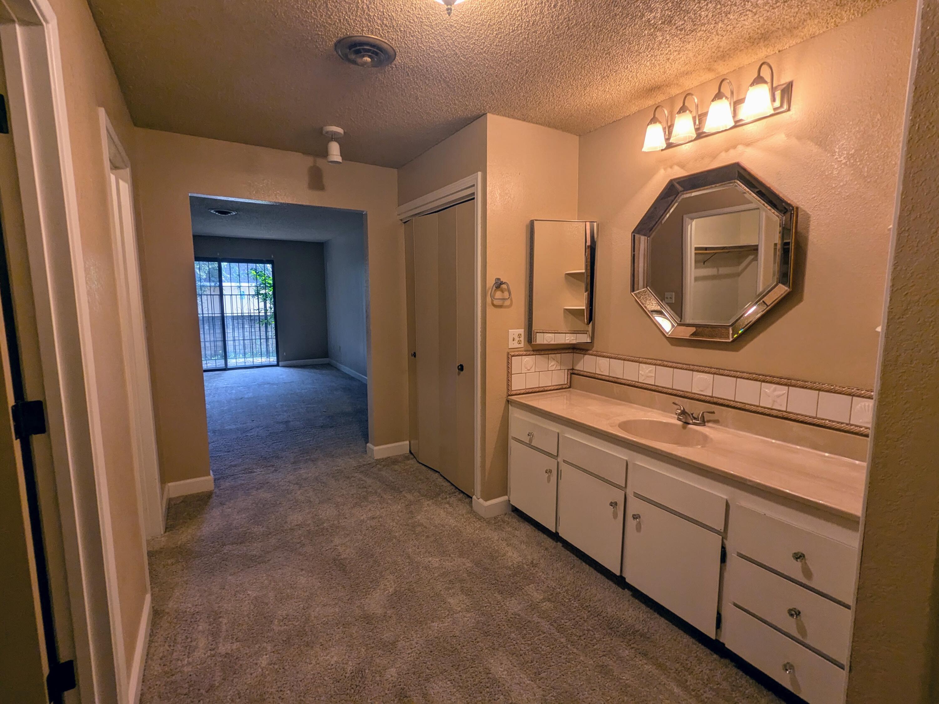 1974 Bechelli Lane Redding, CA 96002 - Photo 43 of 49 a bathroom with a sink and a mirror