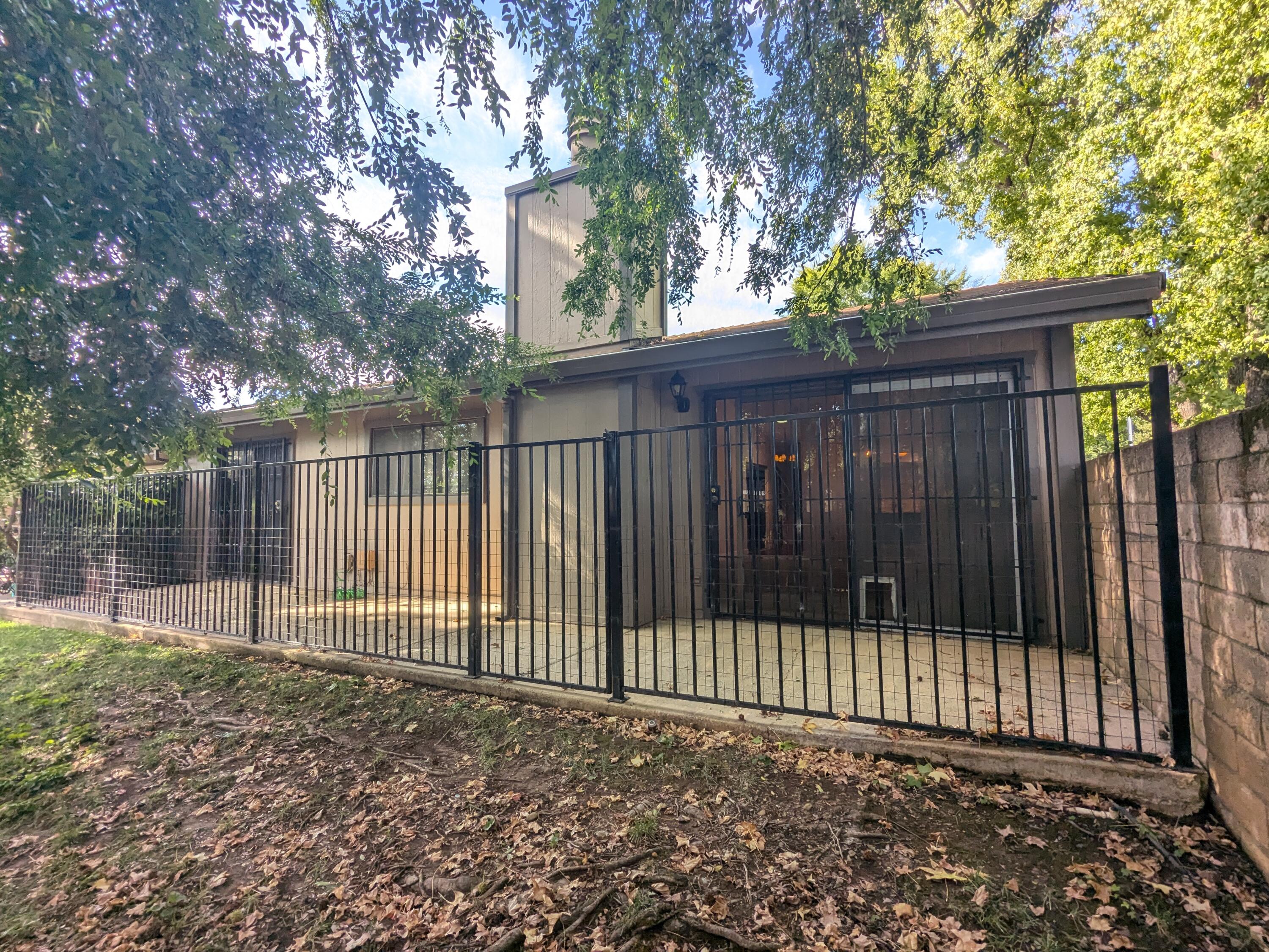 1974 Bechelli Lane Redding, CA 96002 - Photo 44 of 49 a view of a backyard with a fence and wooden fence