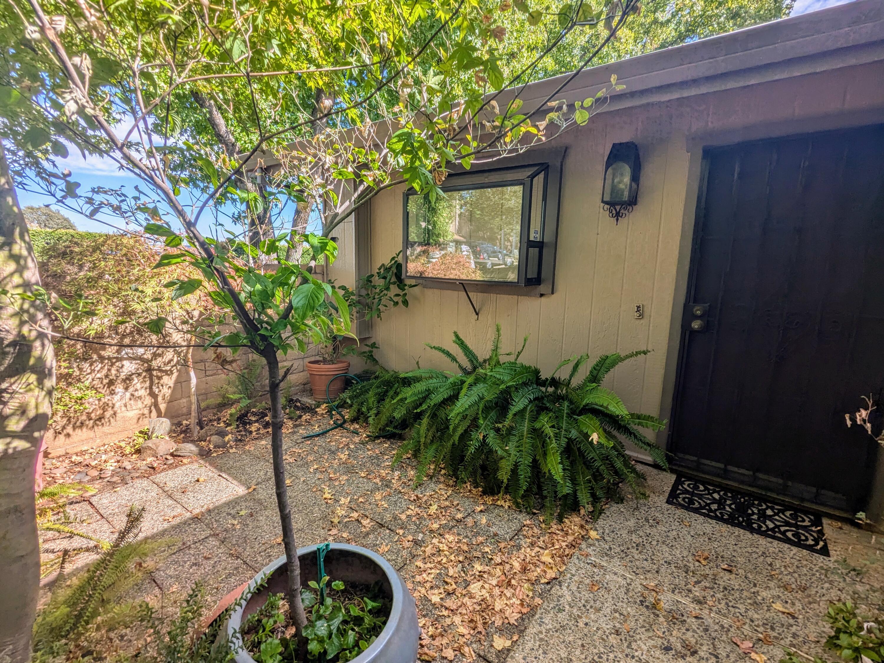 1974 Bechelli Lane Redding, CA 96002 - Photo 10 of 49 a front view of a house with garden