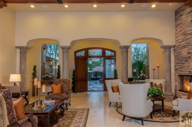 70551 Sunny Lane Rancho Mirage, CA 92270 - Photo 2 of 35 a living room with furniture a fireplace and a potted plant