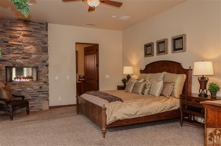70551 Sunny Lane Rancho Mirage, CA 92270 - Photo 16 of 35 a bedroom with a bed and a lamp