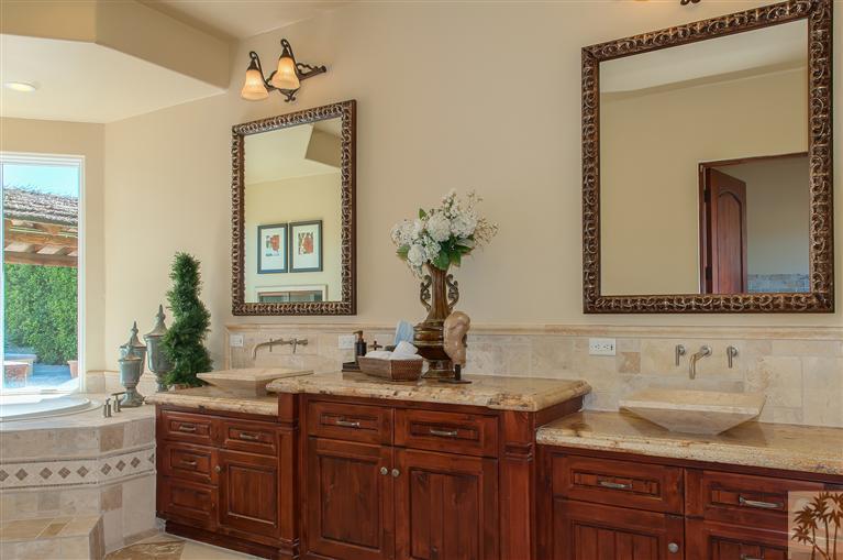 70551 Sunny Lane Rancho Mirage, CA 92270 - Photo 18 of 35 a bathroom with a granite countertop sink and a mirror