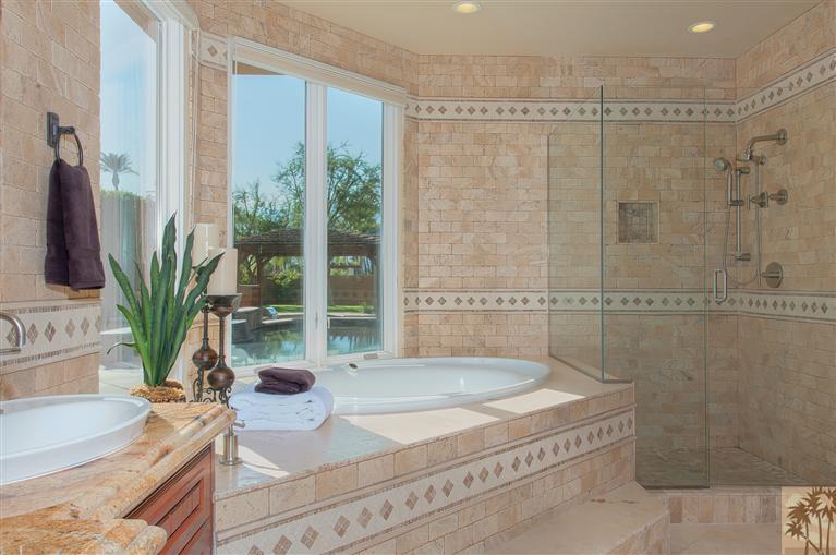 70551 Sunny Lane Rancho Mirage, CA 92270 - Photo 23 of 35 a bathroom with a granite countertop sink a potted plant and a shower