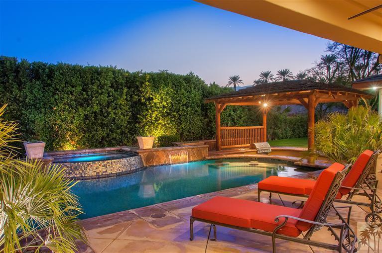 70551 Sunny Lane Rancho Mirage, CA 92270 - Photo 31 of 35 a view of a chairs and table in the backyard