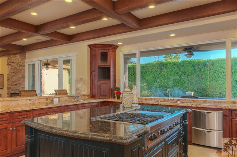 70551 Sunny Lane Rancho Mirage, CA 92270 - Photo 8 of 35 a kitchen with kitchen island granite countertop a sink and a large window