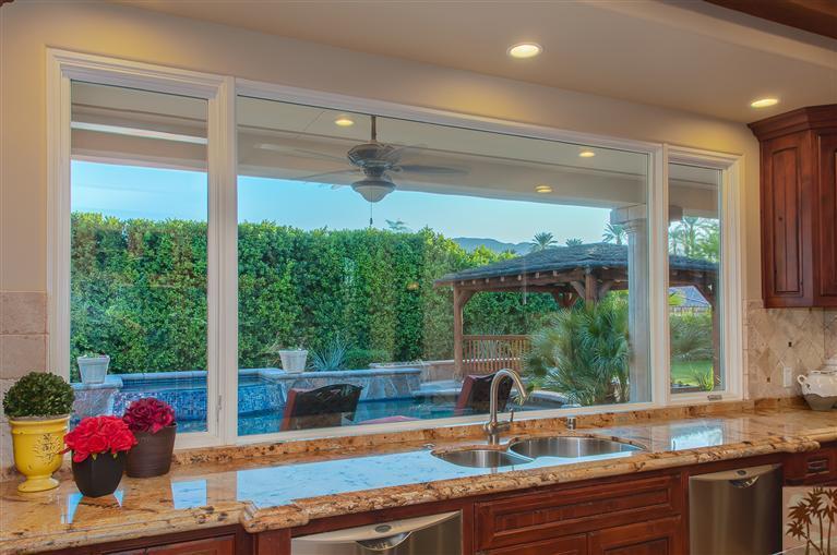 70551 Sunny Lane Rancho Mirage, CA 92270 - Photo 9 of 35 a kitchen with a large window and a table