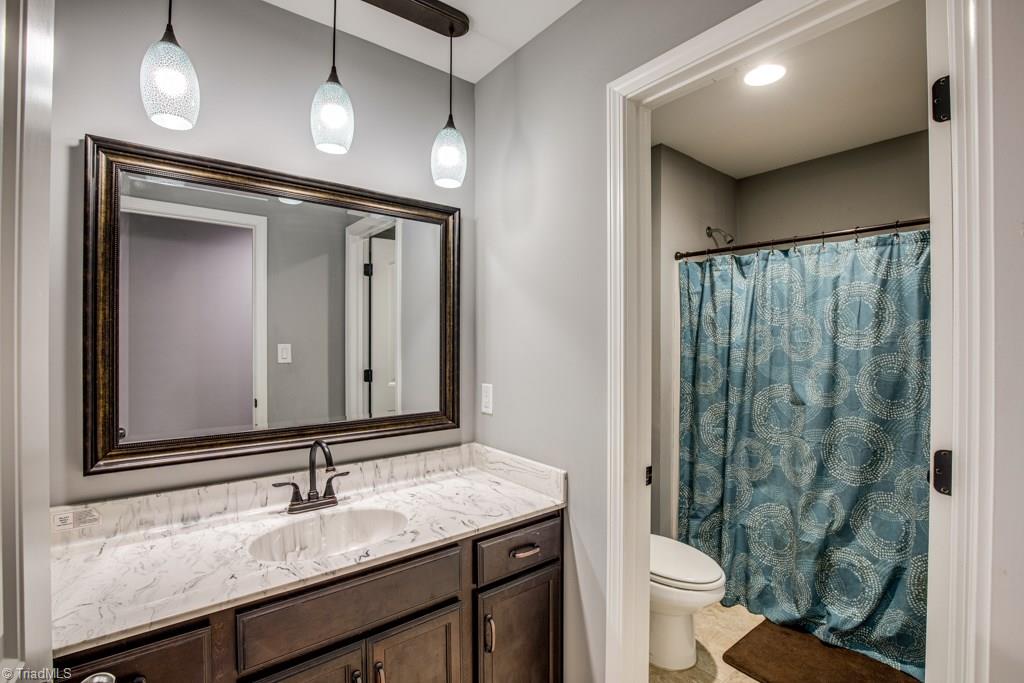 7408 Princess Ann Court Rural Hall, NC 27045 - Photo 24 of 30 3rd bathroom upstairs with beautiful pendant light fixture!