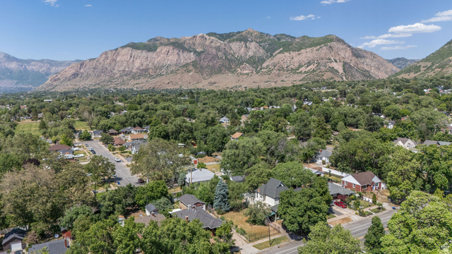 1256 24th Street Ogden, UT 84401 - Photo 32 of 34 Expansive mountain backdrop framing a tree-lined residential area with varied architectural styles