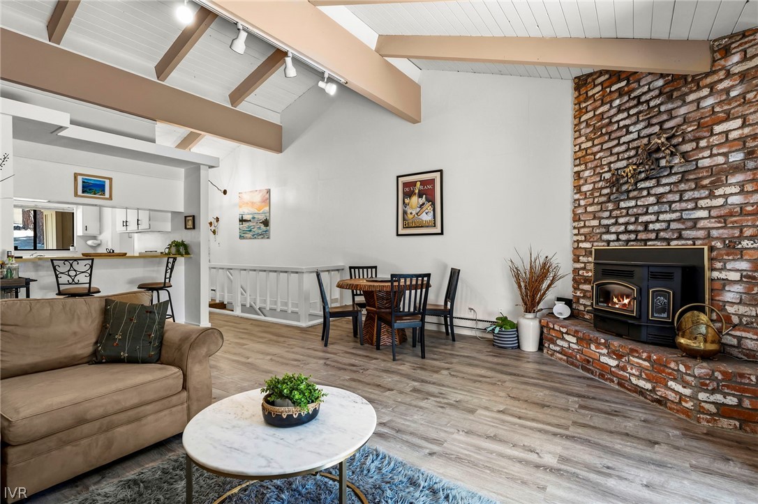 321 Ski Way, Unit 137 Incline Village, NV 89451 - Photo 12 of 21 a living room with furniture a fireplace and a dining table with wooden floor