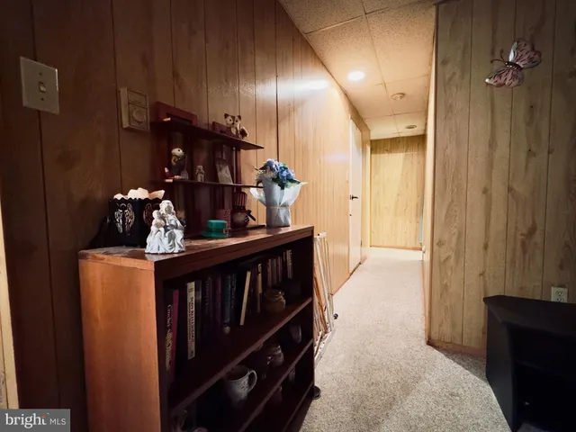 a view of hallway with chandelier