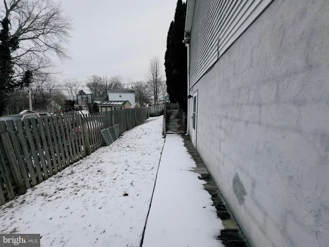 a view of balcony with wooden floor and fence