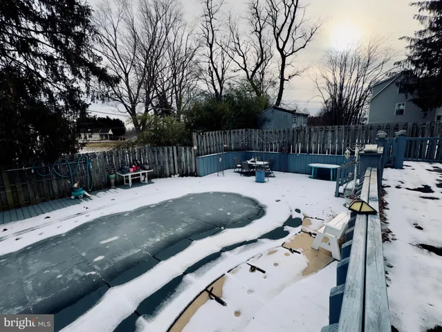 a view of backyard with a car parked