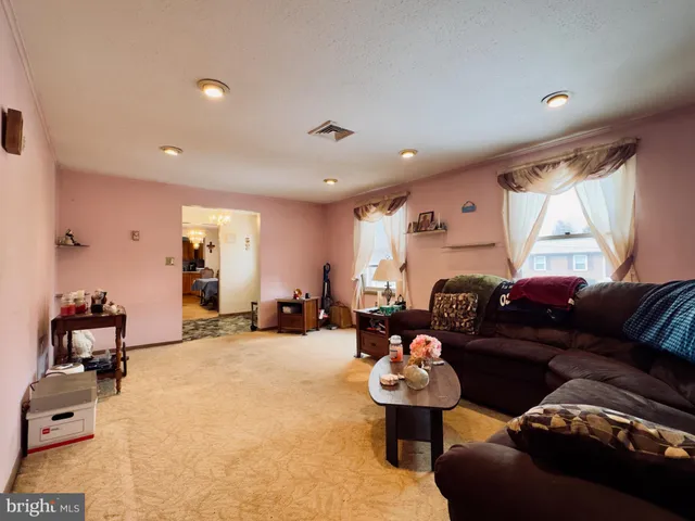a living room with furniture and a couch