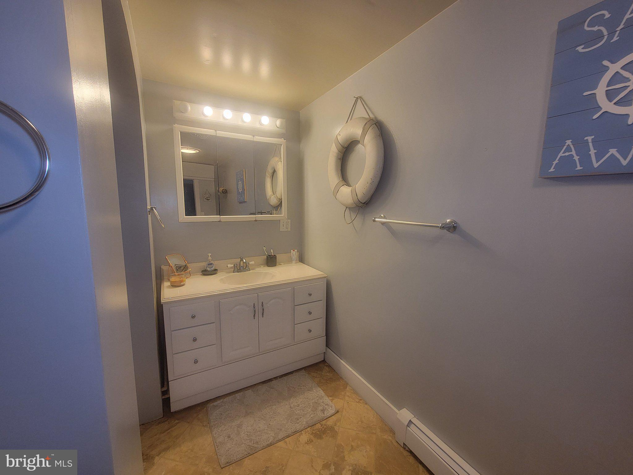 2106 Wingate Bishops Head Road Wingate, MD 21675 - Photo 33 of 37 Coastal charm in a serene bathroom.
