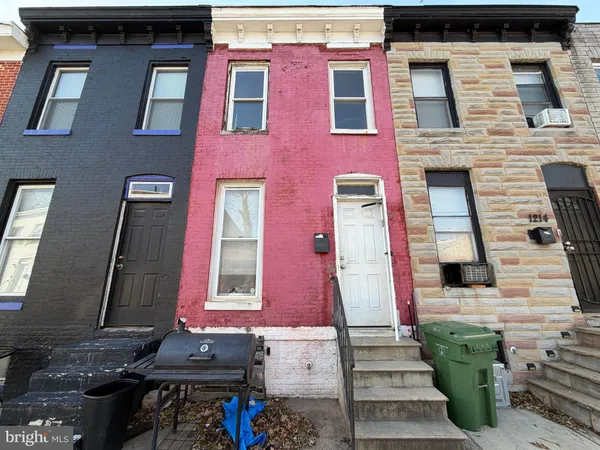 a front view of a brick building with many windows
