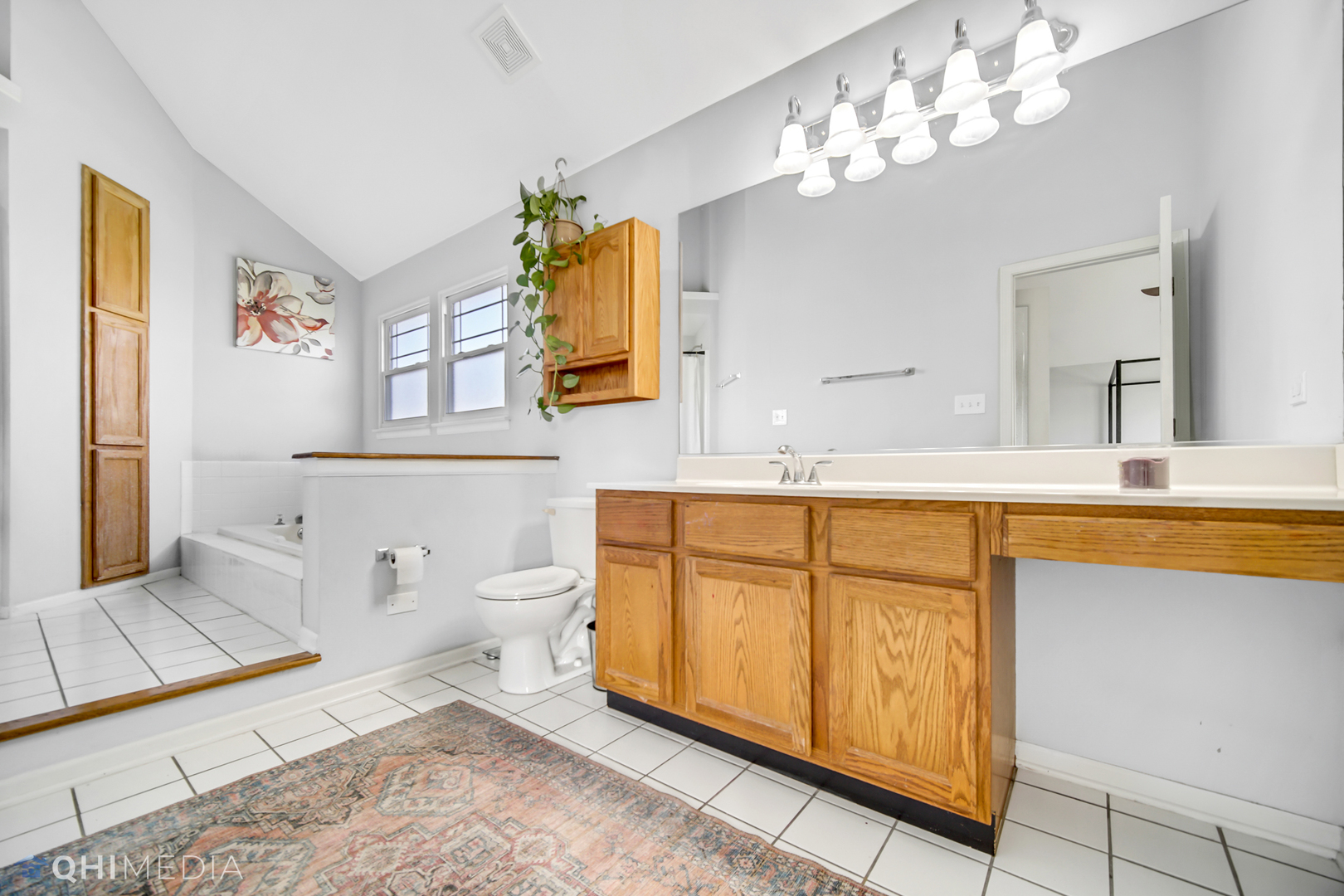 7930 Farmhouse Road Frankfort, IL 60423 - Photo 17 of 24 a spacious bathroom with a granite countertop toilet sink and mirror