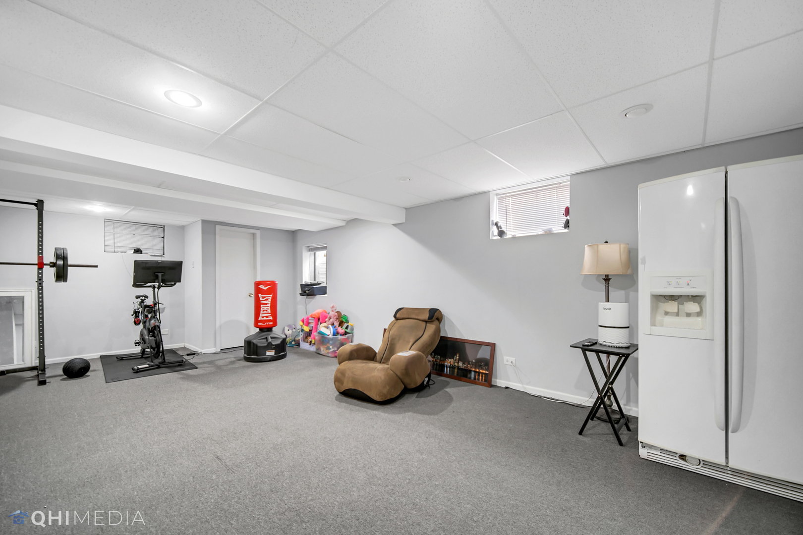 7930 Farmhouse Road Frankfort, IL 60423 - Photo 20 of 24 a room with gym equipment and air hockey table