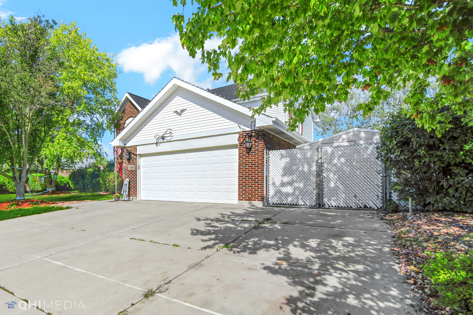 7930 Farmhouse Road Frankfort, IL 60423 - Photo 2 of 24 a view of a house with a yard and large tree