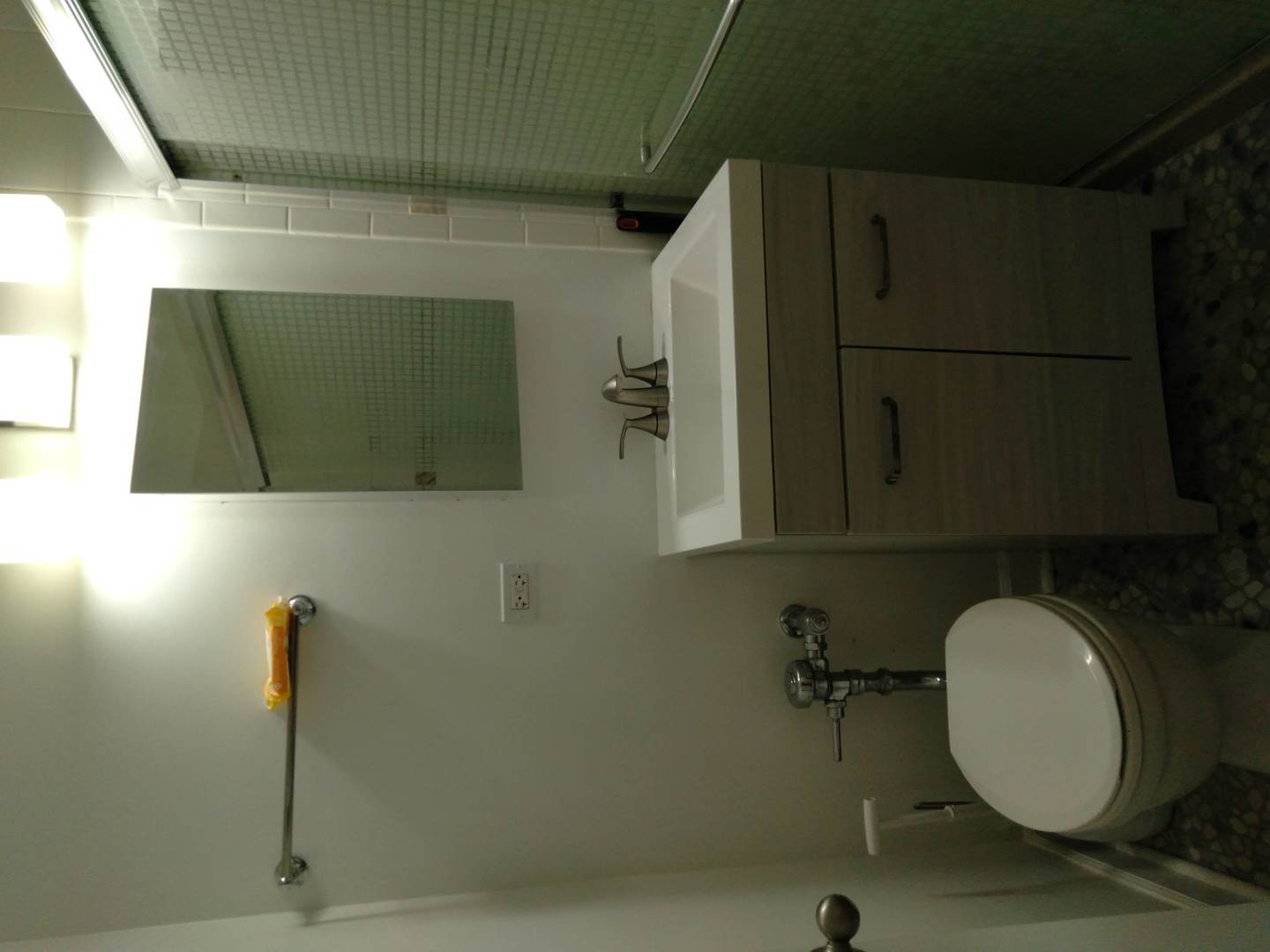 907 Austin Street, Unit 2 Evanston, IL 60202 - Photo 6 of 9 a bathroom with a sink and a mirror