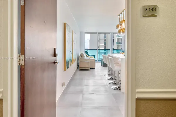 a bathroom with a tub shower and window