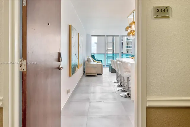 a bathroom with a tub shower and window