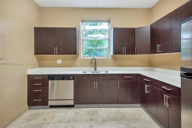 a view of a livingroom with furniture and a window