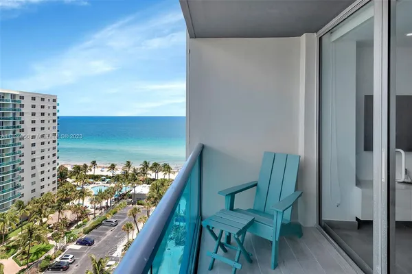 a view of a balcony and a yard