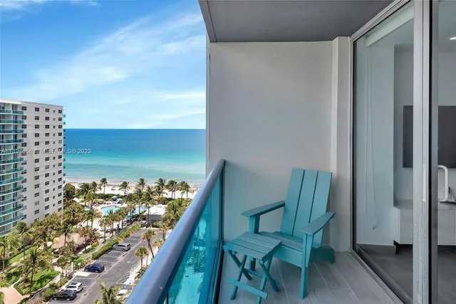 a view of a balcony and a yard