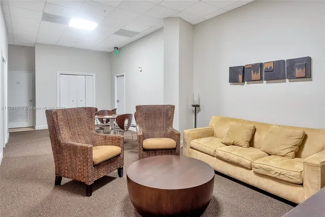 a view of a room with furniture and a wooden floor