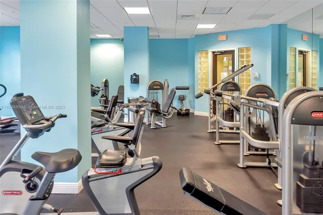 a view of a backyard with plants and outdoor seating
