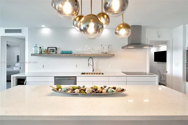 a view of a living room and kitchen