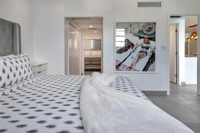 a bedroom with a bed and a walk in closet