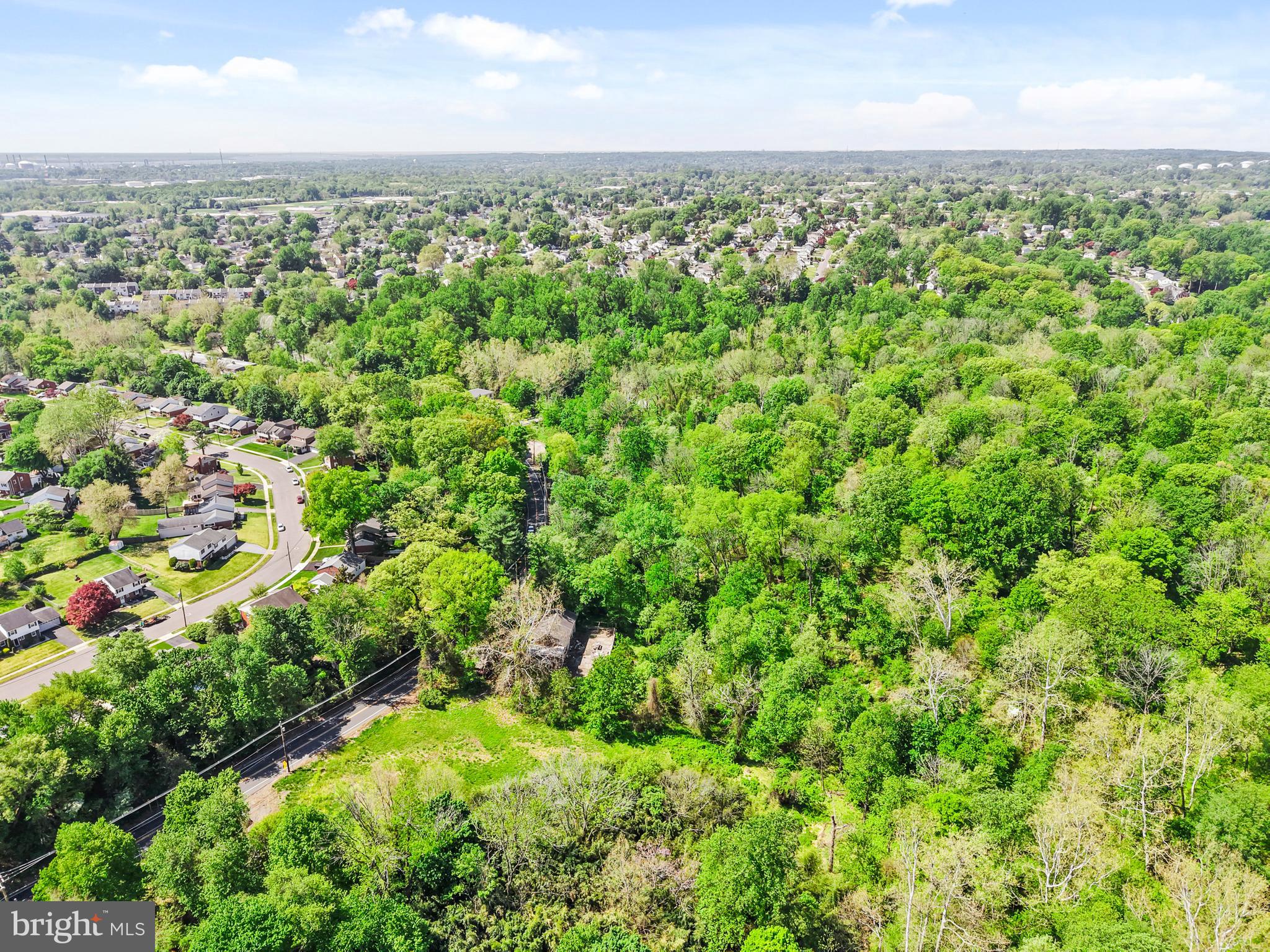 386 Dutton Mill Road Brookhaven, PA 19015 - Photo 8 of 12 an aerial view of residential houses with outdoor space and trees