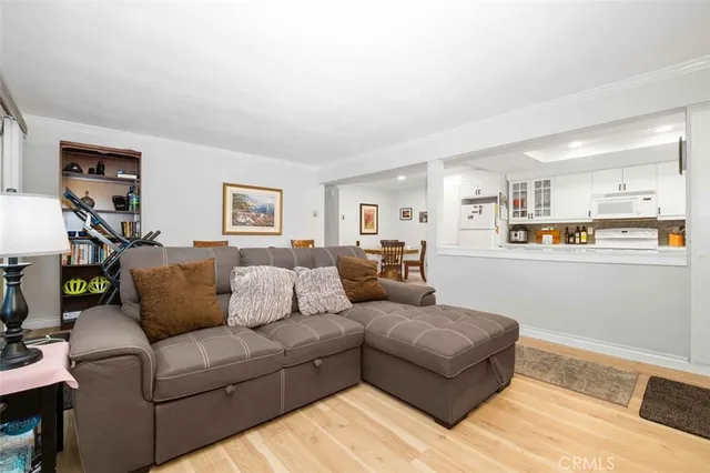 a kitchen with a refrigerator a sink and cabinets