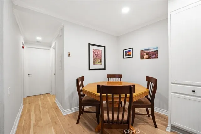 a bedroom with a bed and a night stand