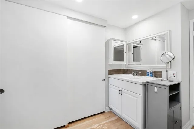 a bathroom with a granite countertop shower and a toilet