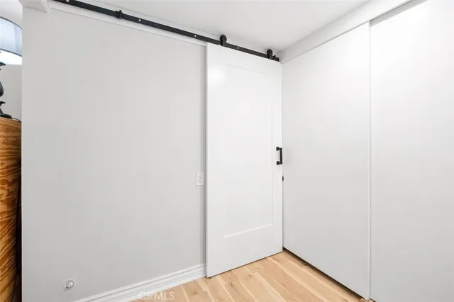 a bathroom with a granite countertop sink mirror vanity and toilet