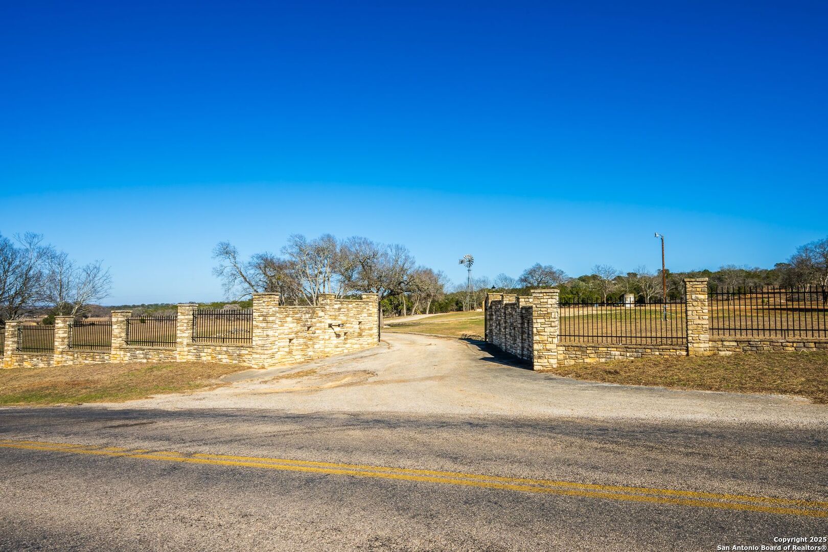 327 Waring Welfare Road Boerne, TX 78006 - Photo 5 of 17 a view of a swimming pool with an outdoor space and seating area