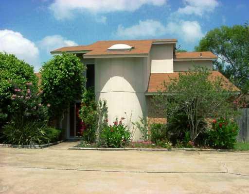 6718 Hunt Drive Corpus Christi, TX 78413 - Photo 1 of 1 a front view of a house with garden