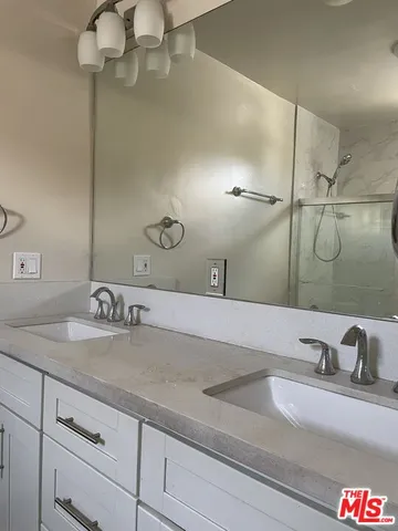 a bathroom with a sink and vanity