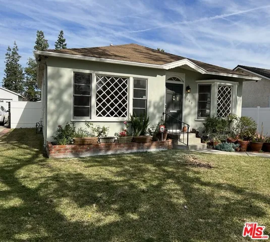 a front view of a house with swimming pool