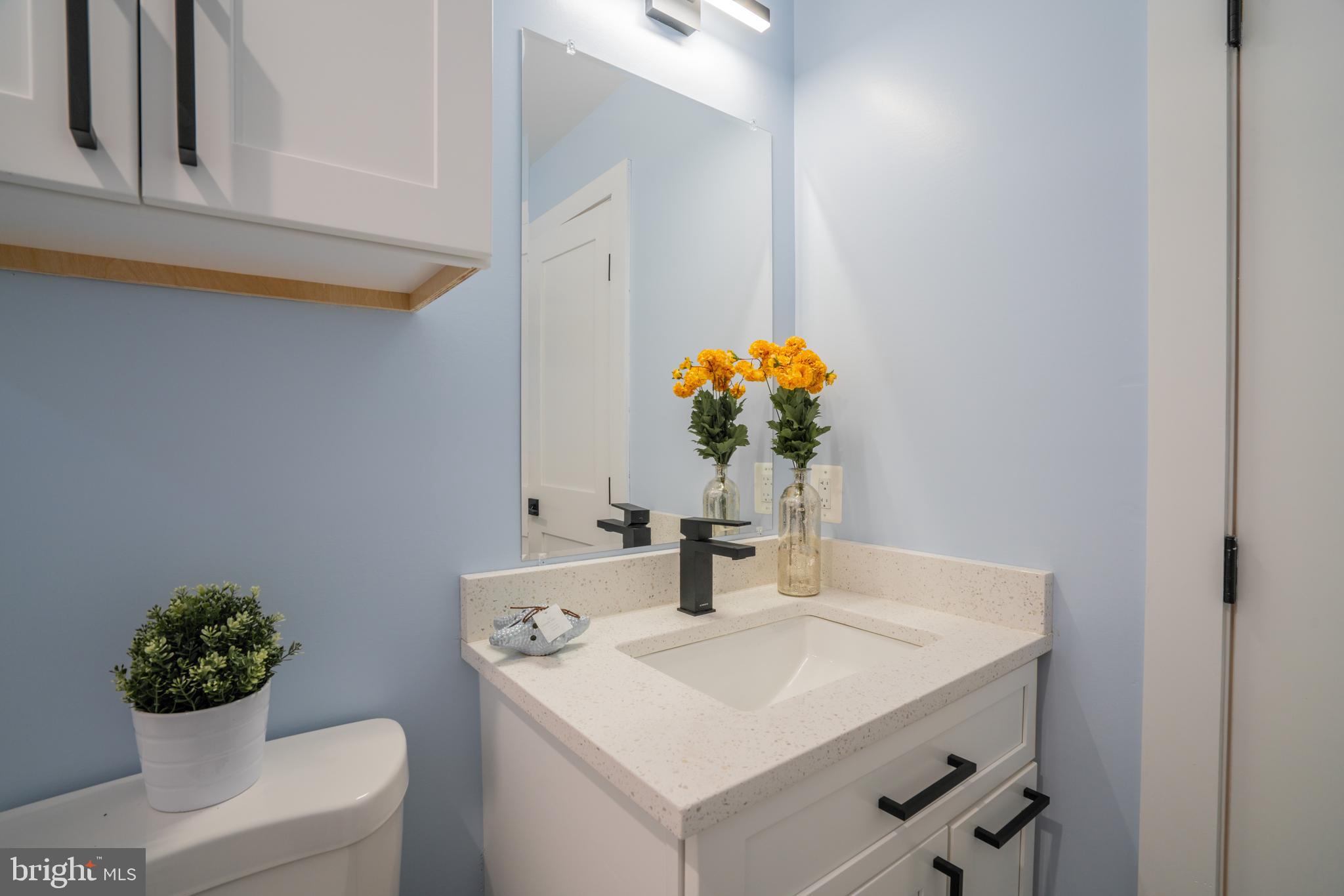 1225 Park Road Northwest, Unit 1 Washington, DC 20010 - Photo 13 of 38 a bathroom with a sink and a mirror