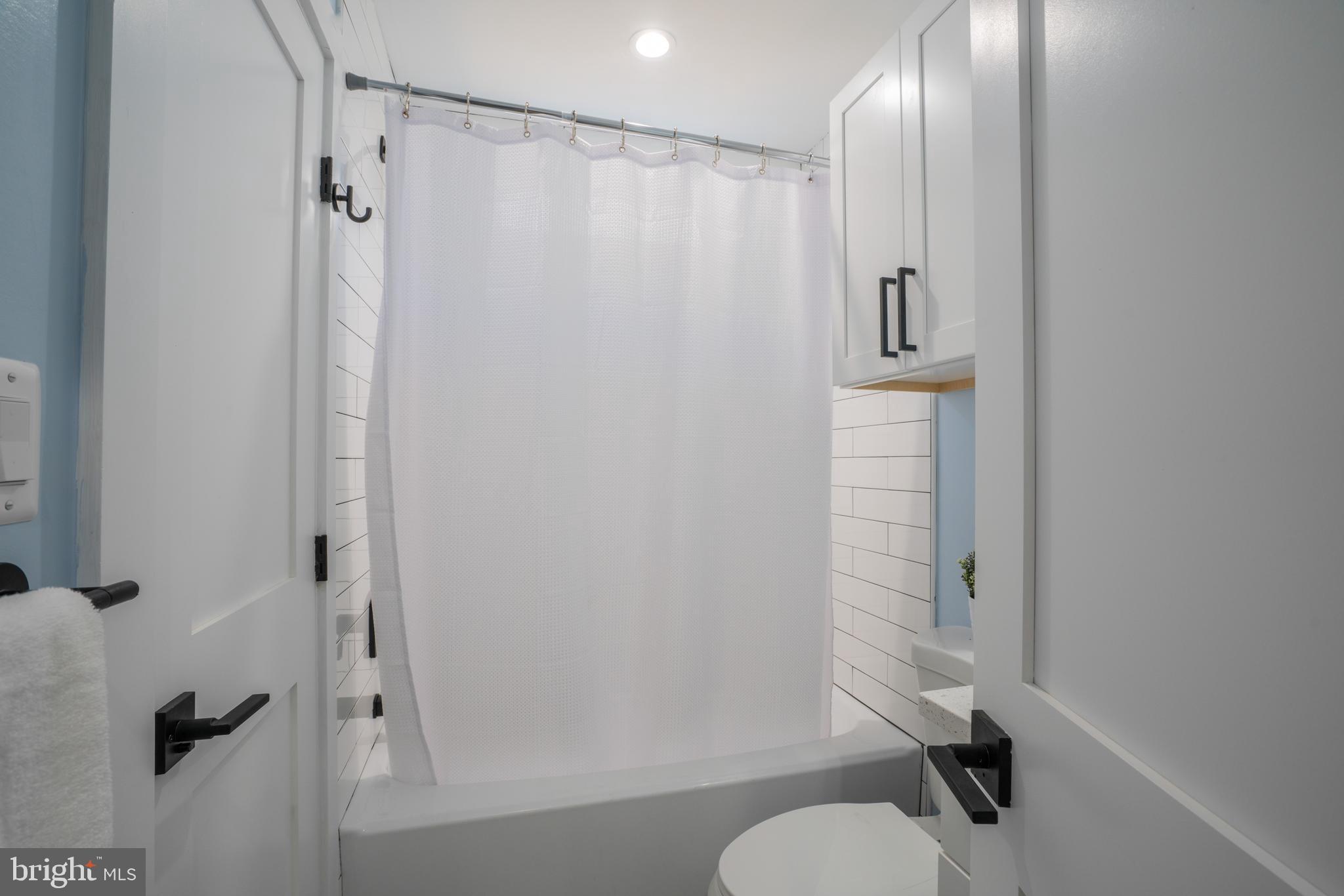 1225 Park Road Northwest, Unit 1 Washington, DC 20010 - Photo 14 of 38 a bathroom with a shower and a toilet